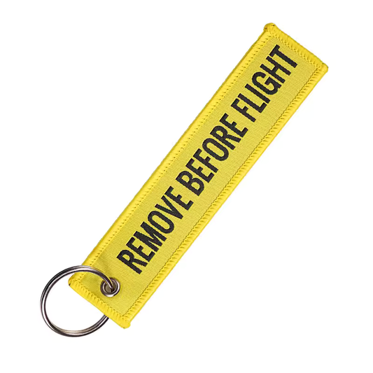 Gele Remove Before Flight Sleutelhanger Tweetaktshop